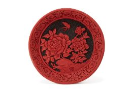 A CARVED CINNABAR LACQUER PLATE