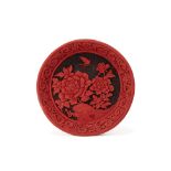 A CARVED CINNABAR LACQUER PLATE