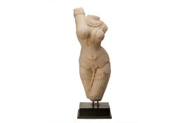 AN INDIAN SANDSTONE FIGURE OF YAKSHI