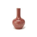 A PEACH BLOOM GLAZED PORCELAIN BOTTLE VASE