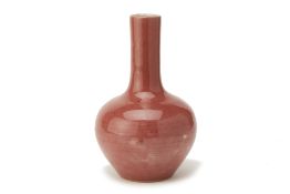 A PEACH BLOOM GLAZED PORCELAIN BOTTLE VASE