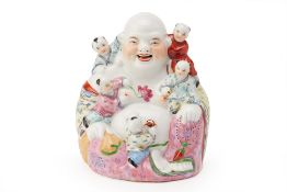 A FAMILLE ROSE PORCELAIN MODEL OF BUDAI