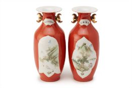 A PAIR OF RED GROUND SMALL TWIN HANDLED VASES