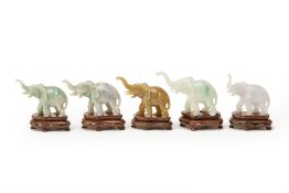 FIVE CARVED JADE MODELS OF ELEPHANTS