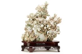 A LARGE JADE CARVING OF BIRDS, FLOWERS AND AUSPICIOUS ITEMS