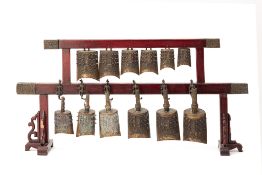 A SET OF CHINESE COURTS CHIMES ON STAND