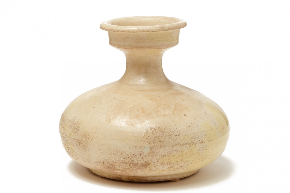 A WHITE-GLAZED COMPRESSED VASE