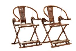 A PAIR OF BRASS-MOUNTED HORSESHOE BACK FOLDING CHAIRS