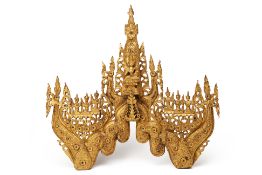 A LARGE BURMESE CARVED GILTWOOD PANEL/ARCH