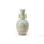 A TURQUOISE GROUND FAMILLE ROSE TWIN HANDLED VASE