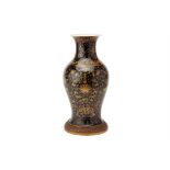 A MIRROR BLACK AND GILT DECORATED BALUSTER VASE