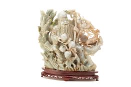 AN INTRICATE JADE CARVING OF SHOULAO