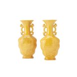 A PAIR OF INCISED YELLOW GLAZED DRAGON VASES