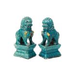 A PAIR OF TURQUOISE GLAZED FOO DOGS