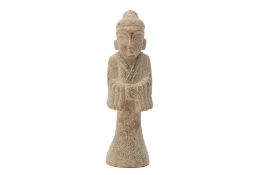 A CARVED STONE FIGURE OF AN ATTENDANT