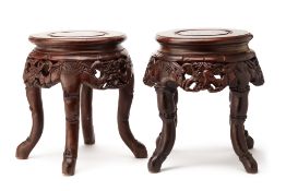 A PAIR OF CARVED AND MOTHER-OF-PEARL INLAID HARDWOOD STOOLS