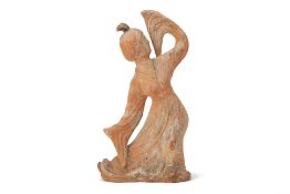 A TANG STYLE POTTERY FIGURE OF A DANCER