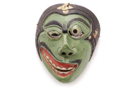 AN INDONESIAN TOPENG DANCE MASK OF A CLOWN CHARACTER