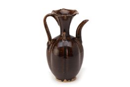 A DARK BROWN GLAZED EWER