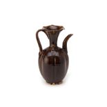 A DARK BROWN GLAZED EWER