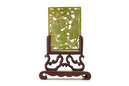 A CARVED AND PIERCED JADE PLAQUE, ON STAND