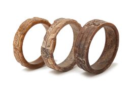 THREE ARCHAIC STYLE JADE BANGLES