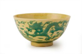 A YELLOW GROUND GREEN ENAMELLED DRAGON AND PHOENIX BOWL