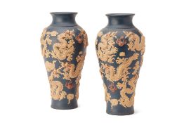 A PAIR OF RELIEF DECORATED BALUSTER DRAGON VASES