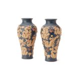 A PAIR OF RELIEF DECORATED BALUSTER DRAGON VASES