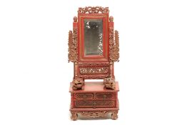 A PERANAKAN CARVED RED AND GILT VANITY MIRROR