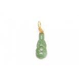 A CARVED JADE GUANYIN PENDANT