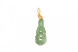 A CARVED JADE GUANYIN PENDANT