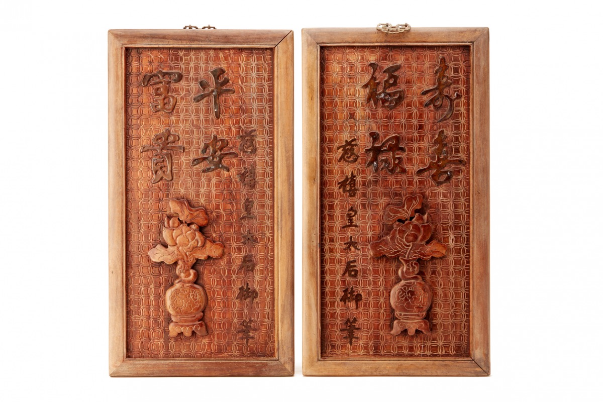 A PAIR OF CARVED WOOD PANELS