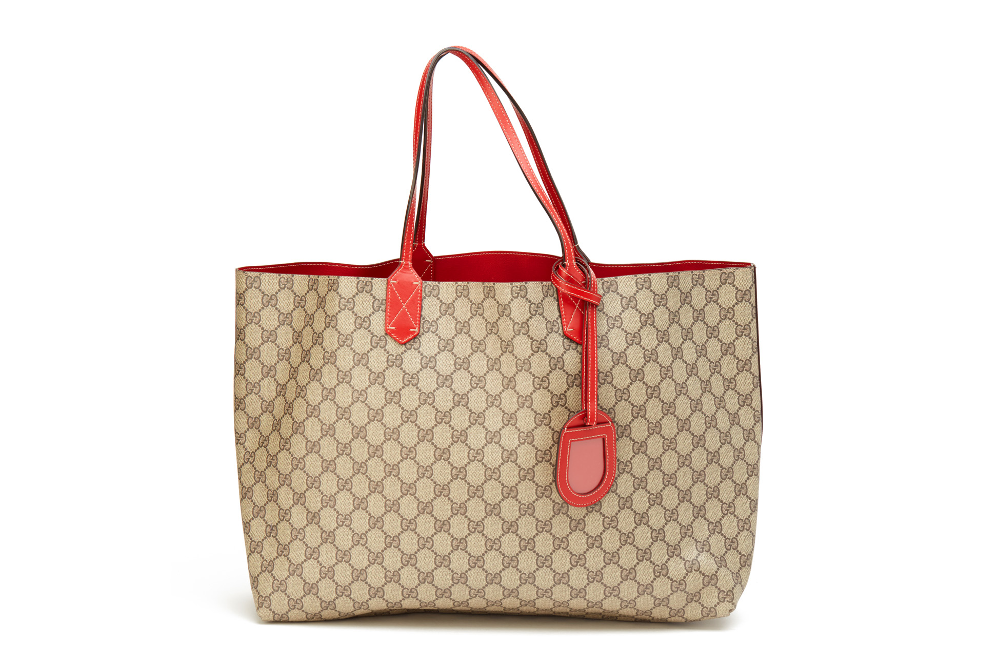 A GUCCI MONOGRAM GG REVERSIBLE LEATHER TOTE BAG