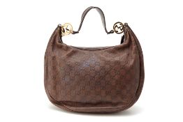 A GUCCI DARK BROWN LEATHER HANDBAG