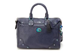 A COACH NAVY BLUE LEATHER HANDBAG