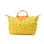 A LONGCHAMP YELLOW & ORANGE ZODIAC 'LE PLIAGE' BAG