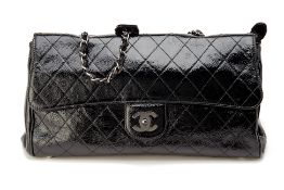 A CHANEL BLACK PATENT HANDBAG