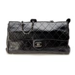 A CHANEL BLACK PATENT HANDBAG