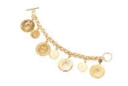 A CHRISTIAN DIOR GOLD TONE VINTAGE COIN CHARM BRACELET