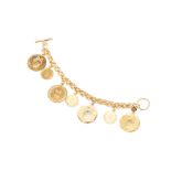 A CHRISTIAN DIOR GOLD TONE VINTAGE COIN CHARM BRACELET