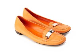 A PAIR OF PRADA ORANGE LEATHER LOAFERS EU 39.5