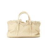 A BOTTEGA VENETA WOVEN LEATHER CREAM HANDBAG