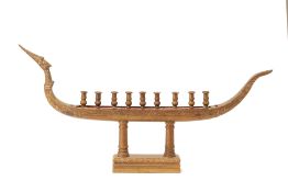 A LARGE THAI BRASS CANDLE HOLDER