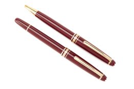 TWO MONTBLANC MEISTERSTUCK BURGUNDY BALLPOINT PENS