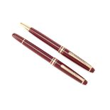 TWO MONTBLANC MEISTERSTUCK BURGUNDY BALLPOINT PENS