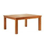 A LARGE SQUARE TEAK DINING TABLE