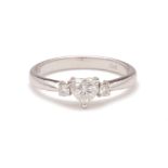 A WHITE GOLD DIAMOND THREE STONE RING