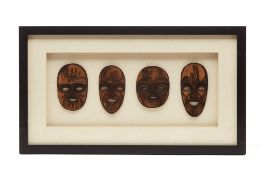 A FRAMED FILIPINO ARTWORK OF MASKS