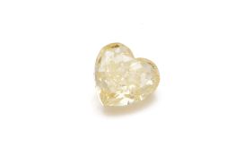 A HEART SHAPED FANCY YELLOW COLOURED LOOSE DIAMOND